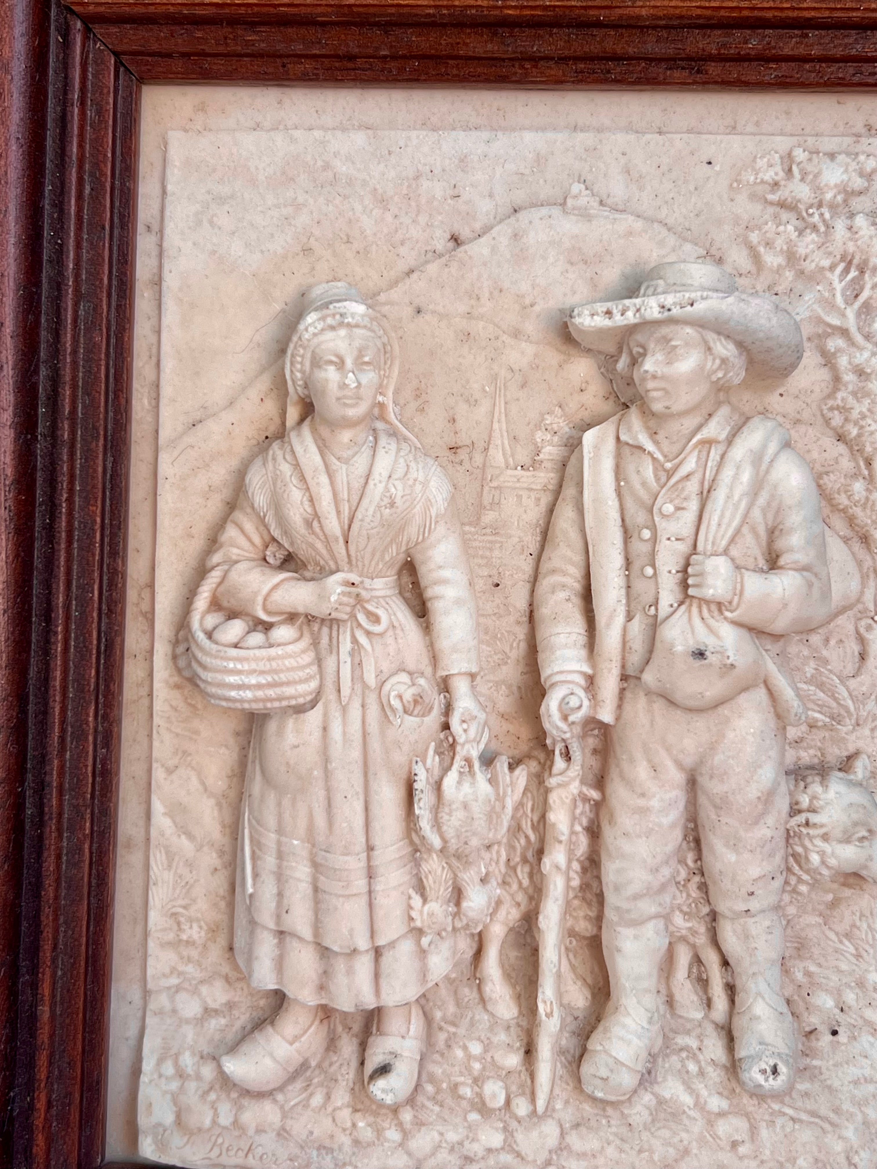 cadre en bas relief signé C.F. Becker.