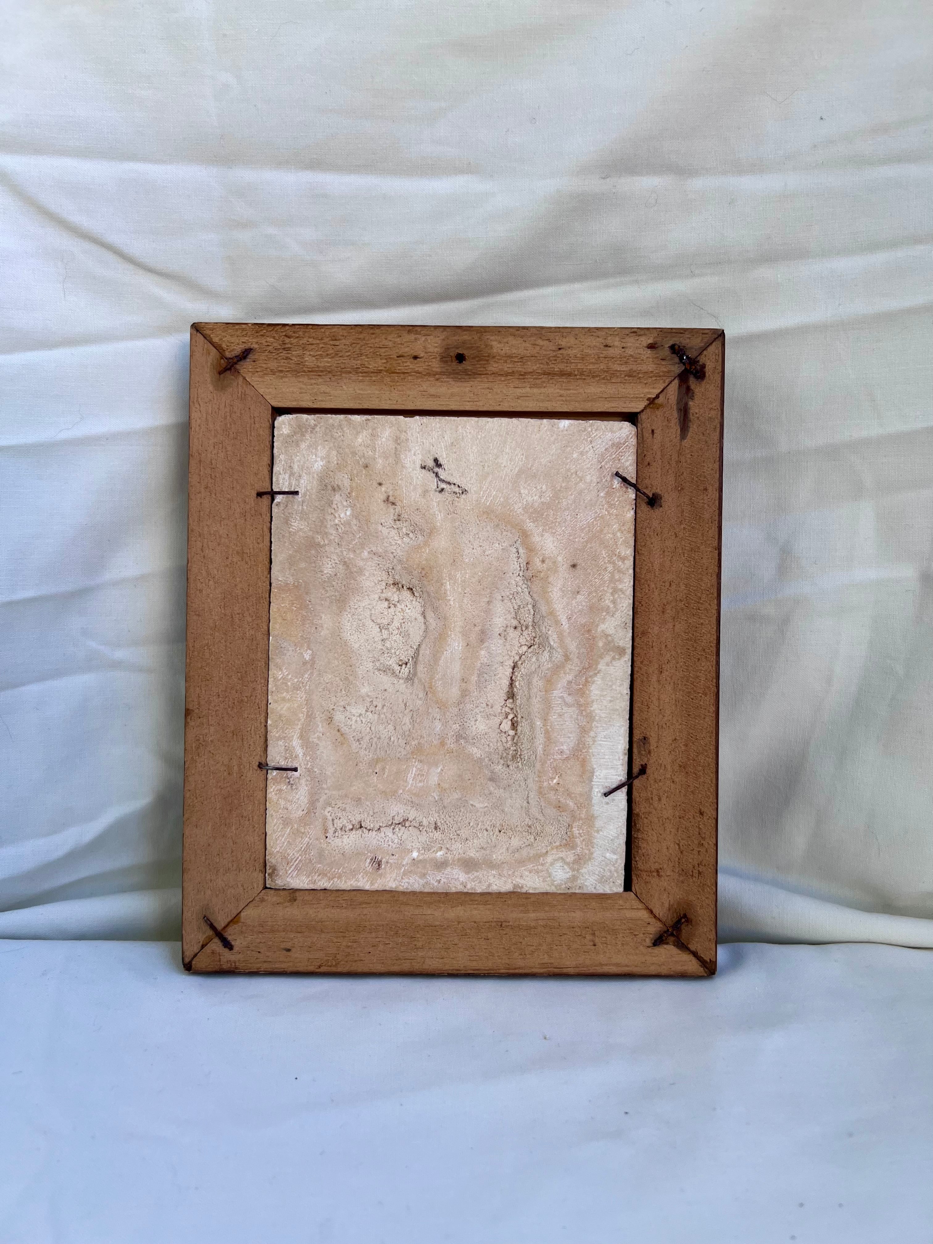 cadre en bas relief signé C.F. Becker.